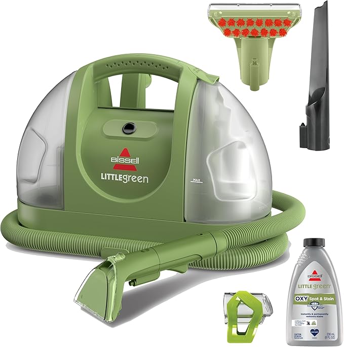 Bissell Little Green 1400B portable carpet cleaner with its hose and included cleaning tools.